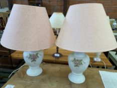 A pair of white ceramic table lamps