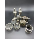 A pair of Duchin Creation sterling silver salt and pepper shakers and other silver items