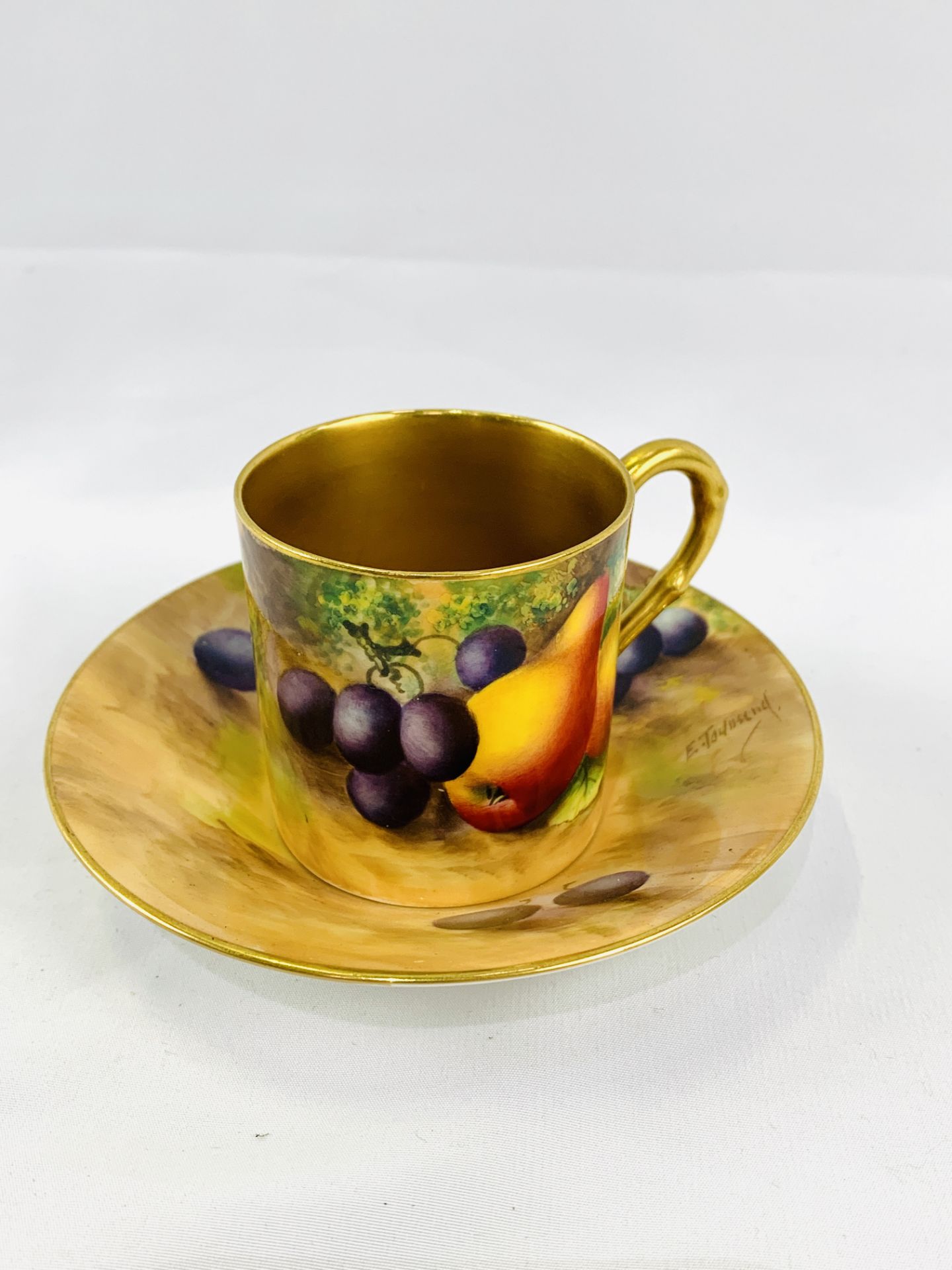Royal Worcester coffee can and saucer painted with peaches and grapes, signed E Townsend