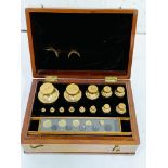 Boxed set of brass standard troy weights, County of Wilts, De Grave & Co