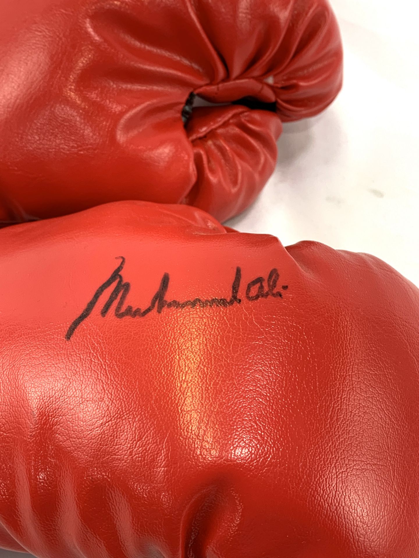 Pair of red Everlast boxing gloves, one signed Muhammad Ali - Image 2 of 2