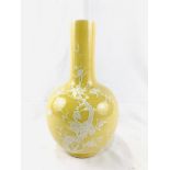 Yellow globe shaped vase