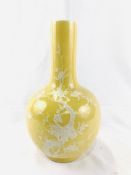 Yellow globe shaped vase