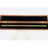 A mahogany boxed brass standard measure gauge