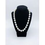 Necklace of 31 natural sea pearls with 18ct gold ball clasp