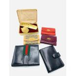 Three Gucci items and a Launer leather card case