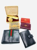 Three Gucci items and a Launer leather card case