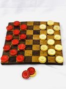 Inlaid chequerboard together with 14 red and 13 white draughts