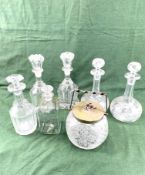A pair of Victorian decanters, a pair of Edwardian decanters, a cut glass biscuit barrel