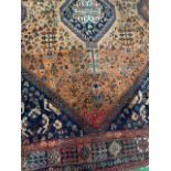 Hand knotted brown and blue ground rug