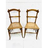 Pair of decorative cane seat arched back bedroom chairs