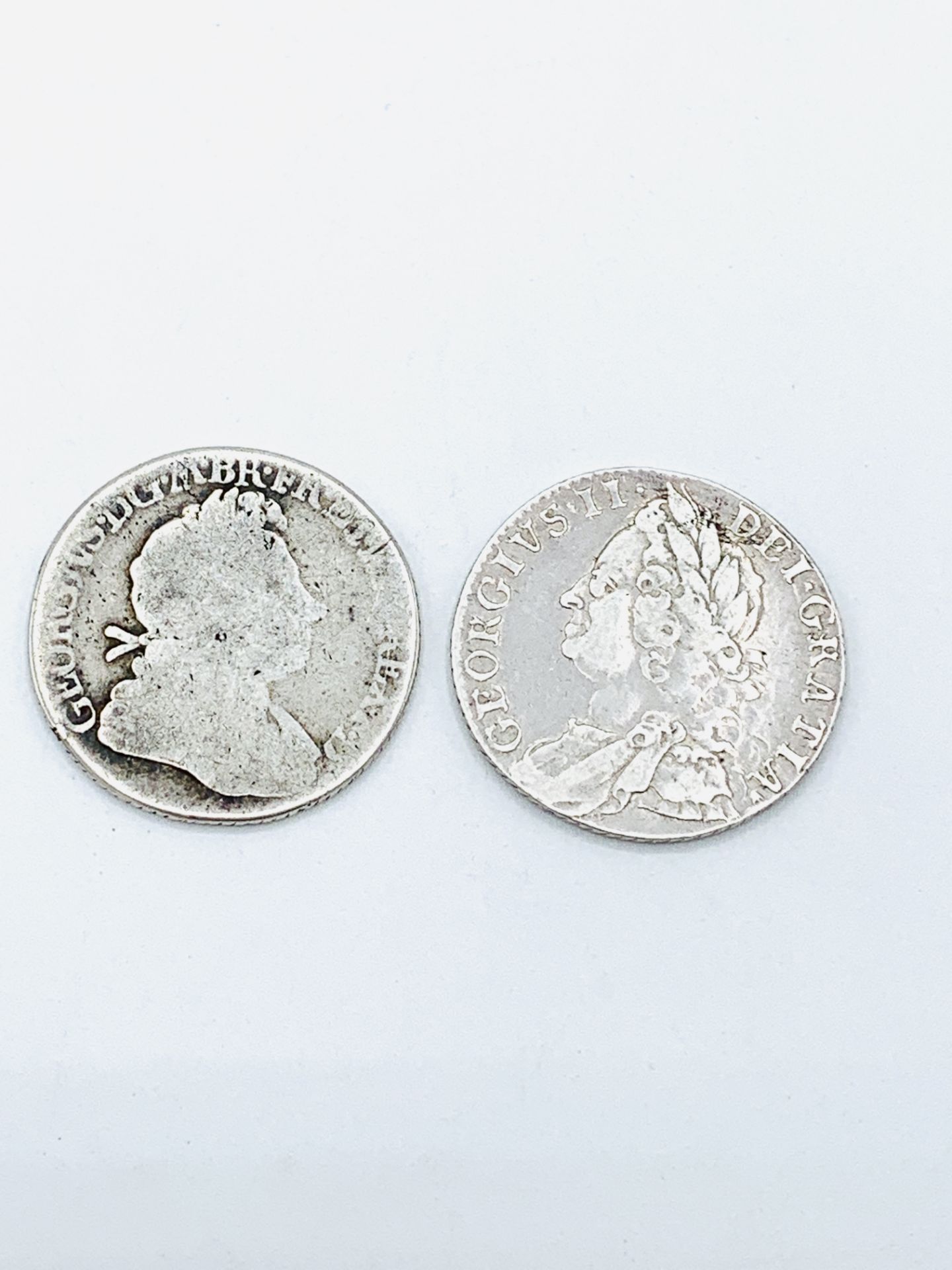 Two Georgian silver shillings