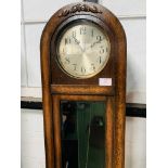 A 1930's style oak dome topped long case clock