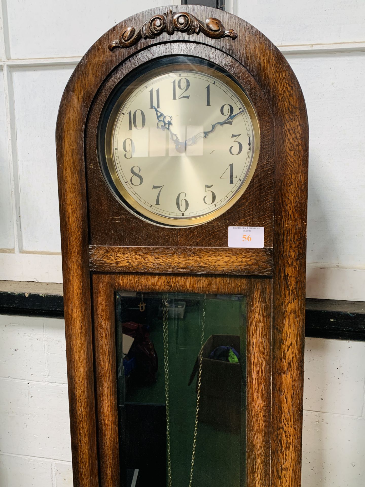 A 1930's style oak dome topped long case clock