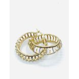 A pair of yellow and white 14ct gold hoop earrings