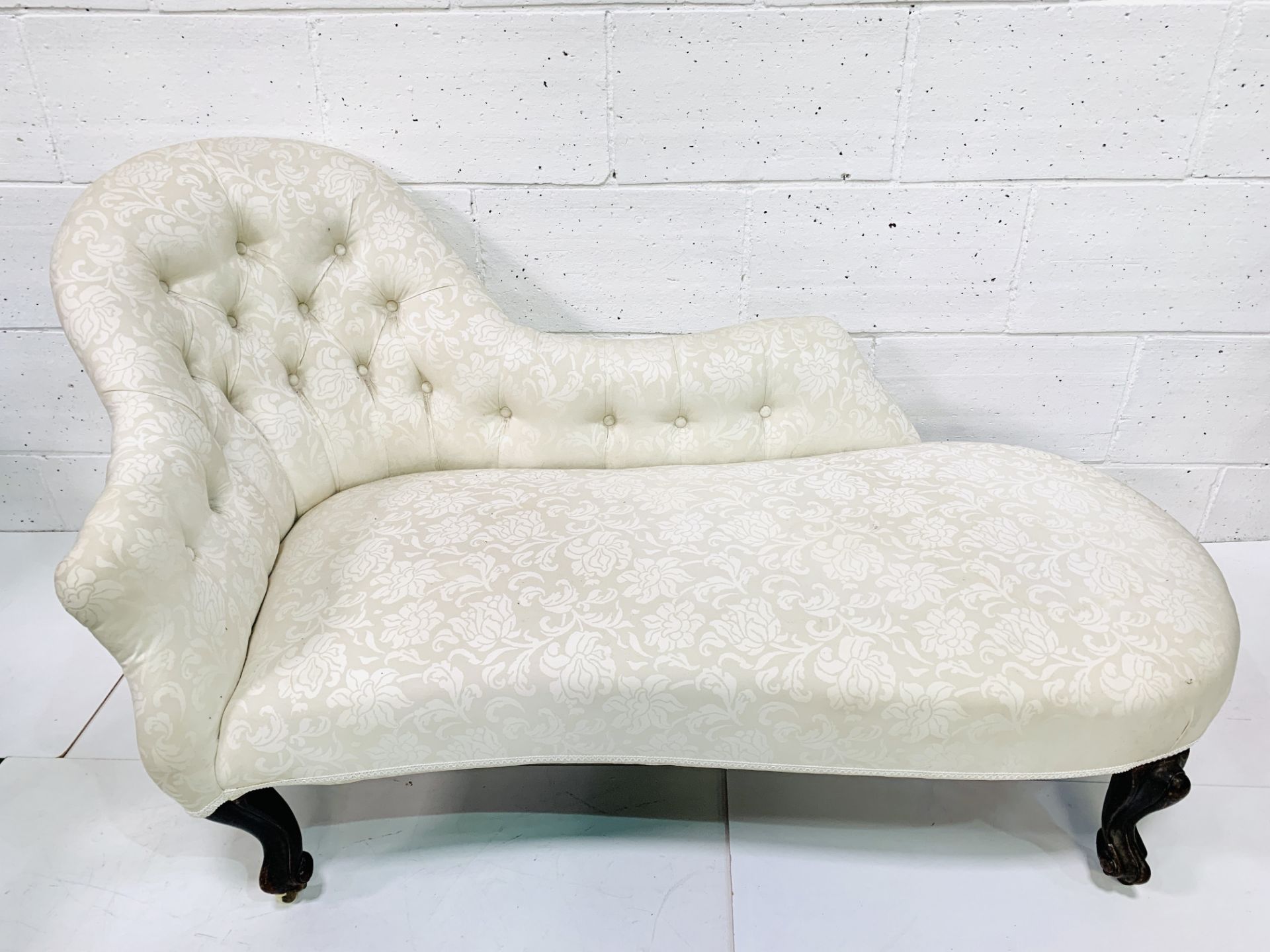 Victorian chaise longue in button back cream floral pattern upholstery