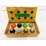 A boxed set of eight egg poisers