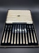 Set of six silver handled and stainless steel dessert knives and forks