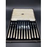 Set of six silver handled and stainless steel dessert knives and forks