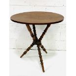 Oval mahogany occasional table on turned tripod supports