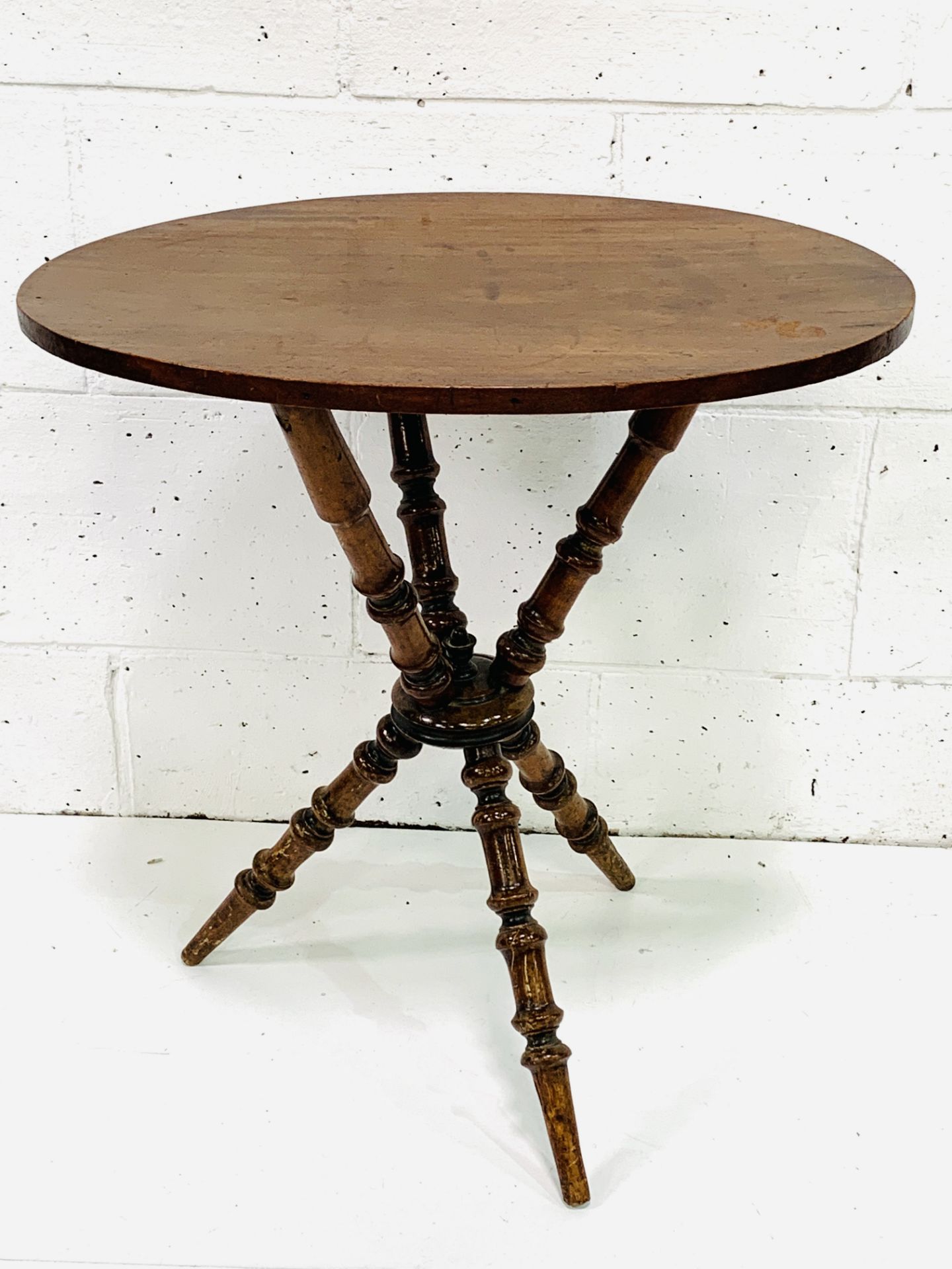 Oval mahogany occasional table on turned tripod supports