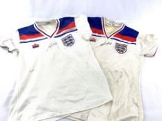 Two England football shirts, No 7 and No 9, both signed by Kevin Keegan