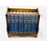 An oak book trough together with a complete set of 8 volumes of The Children's Hour,