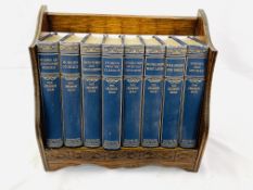 An oak book trough together with a complete set of 8 volumes of The Children's Hour,