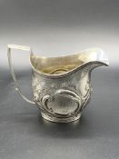 A Georgian silver cream jug hallmarked London 1807