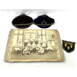 Black and white photograph of a Cheshire Rugby team circa 1895, a shirt badge and 2 velvet caps