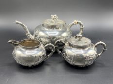 Chinese export silver tea set of teapot, lidded sugar bowl and milk jug, marked K.W