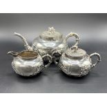 Chinese export silver tea set of teapot, lidded sugar bowl and milk jug, marked K.W