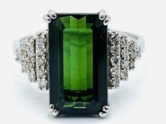 White gold ring with large baguette cut chrome tourmaline and diamond shoulders