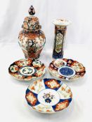 Large lidded Imari jar, Imari vase, and three Imari plates