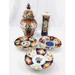 Large lidded Imari jar, Imari vase, and three Imari plates