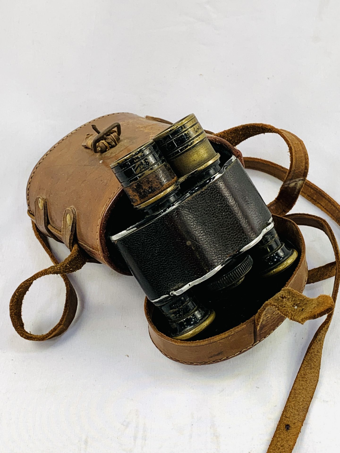 Early 20th Century leather covered binoculars by Aitchison in original brown leather case