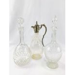 Two faceted glass decanters and a claret jug