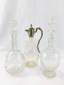 Two faceted glass decanters and a claret jug