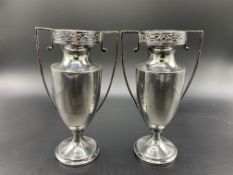 A pair of silver Empire style two-handled vases hallmarked Chester 1927