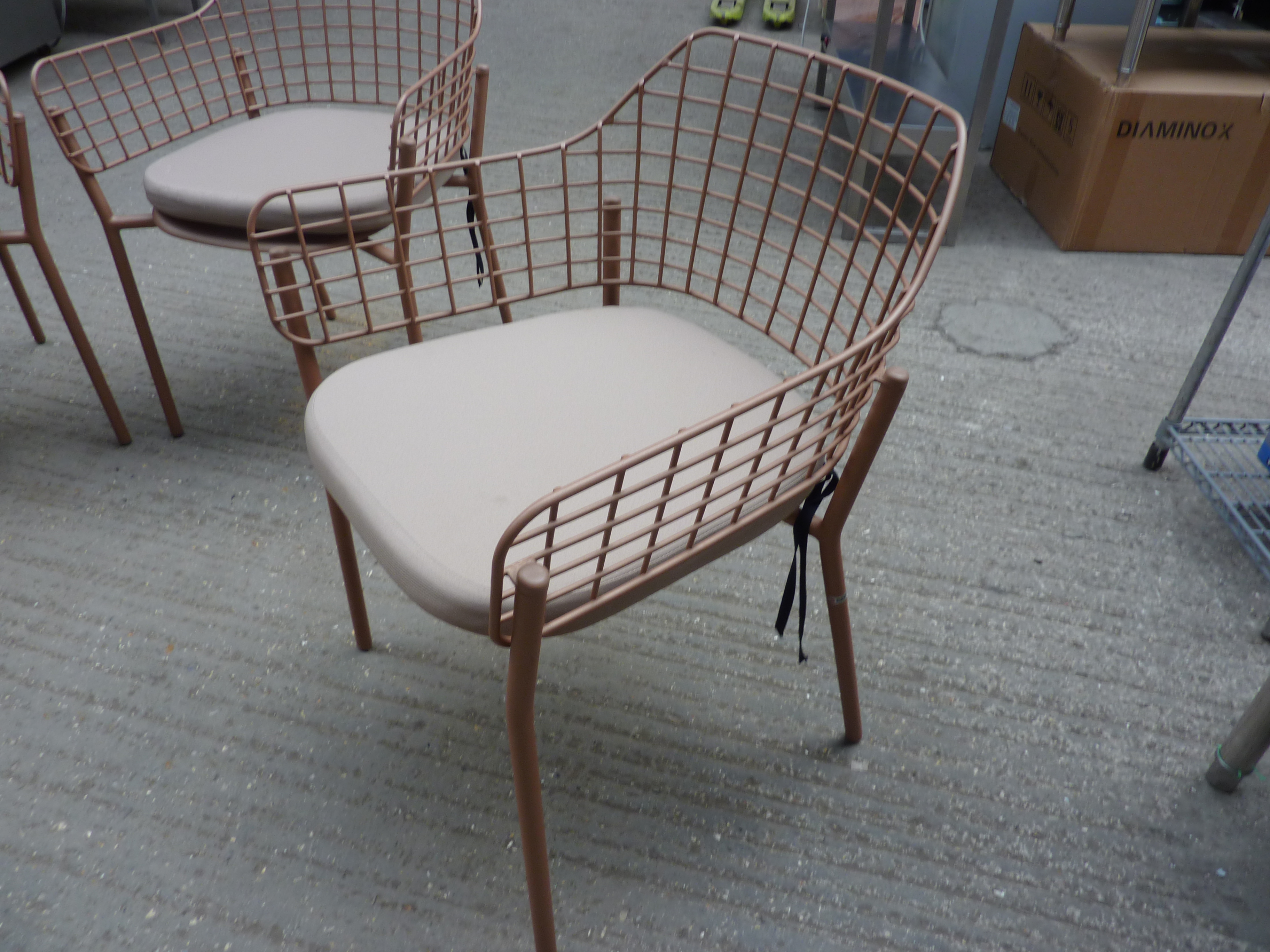 Four Emu metal stacking armchairs with four cushions - Image 2 of 2