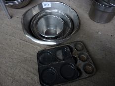 Four mixing bowls and two cake tins