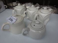 Five ceramic teapots