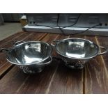 Two stainless steel colanders