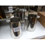 Three stainless steel jugs