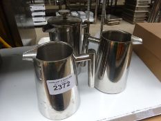 Three stainless steel jugs