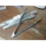 Four stainless steel tongs