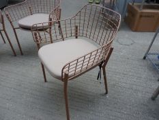 Four Emu metal stacking armchairs with four cushions