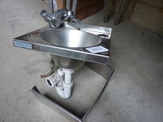 Hand wash sink with mixer taps.