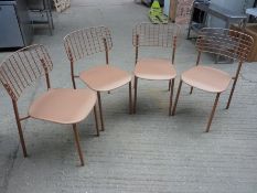 Four Emu metal stacking chairs