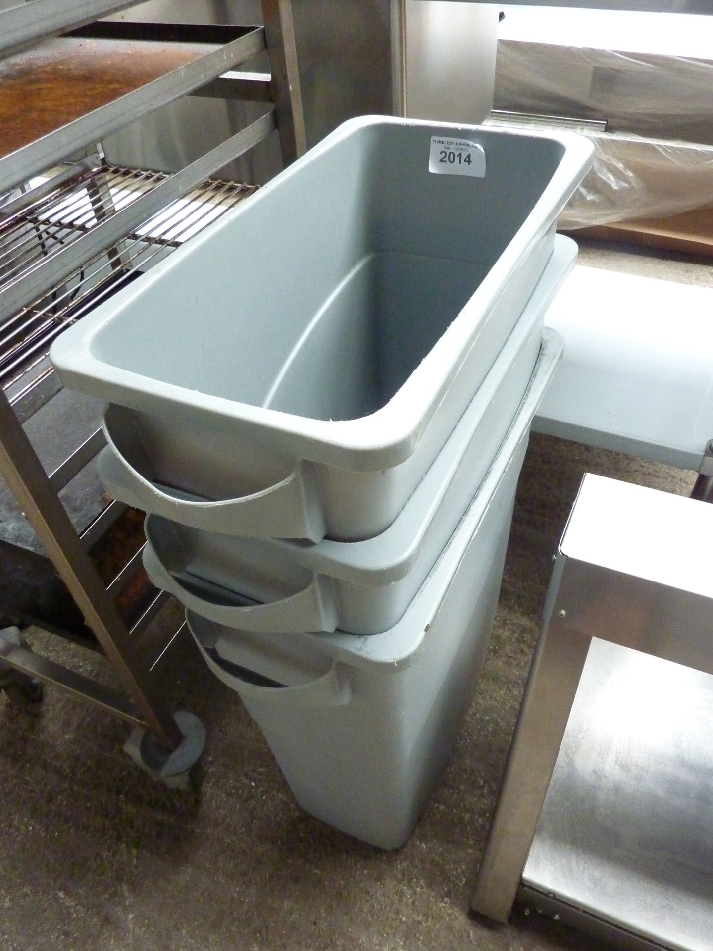 Three Rubbermaid bins